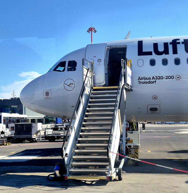 Lufthansa airplane with open door and stairs